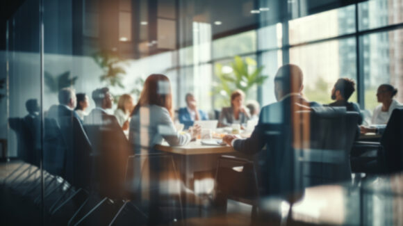 Group of business people having a meeting or brainstorming in a boardroom.